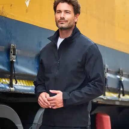 a man standing next to a truck